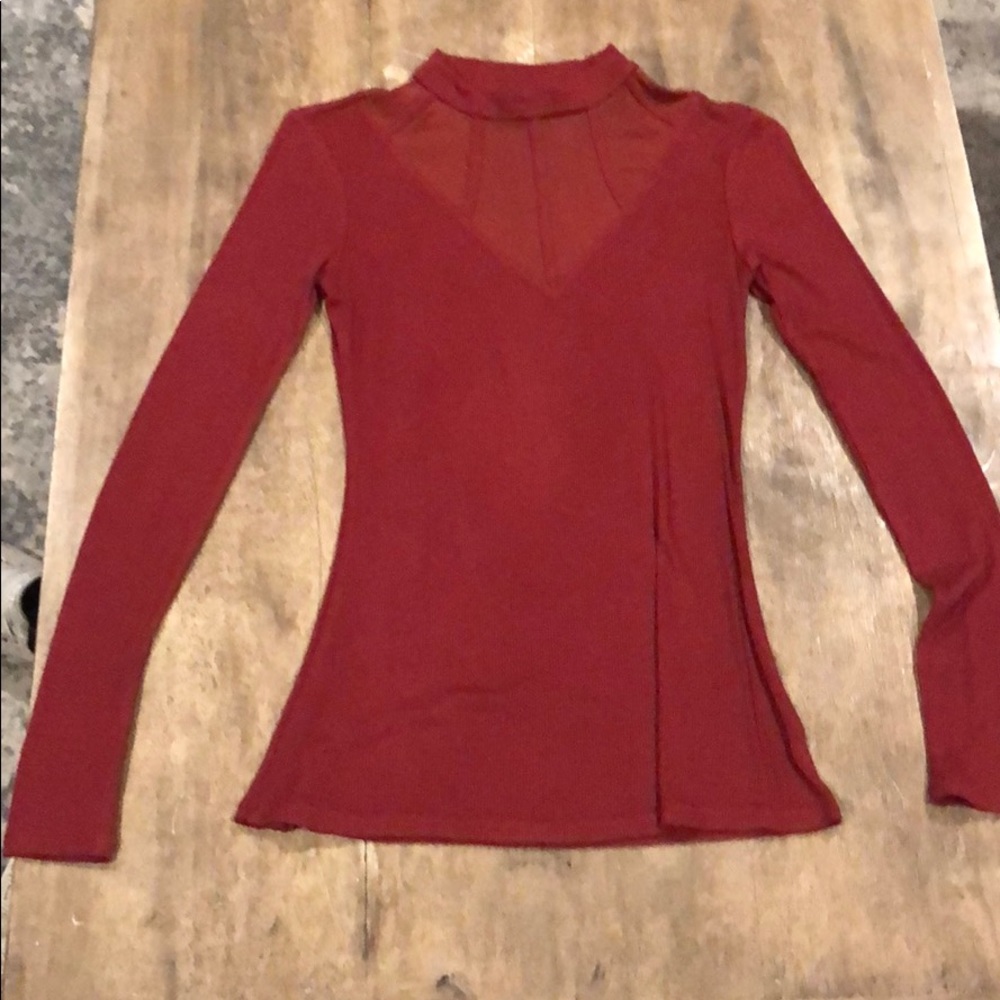 Deep orange ribbed turtleneck.